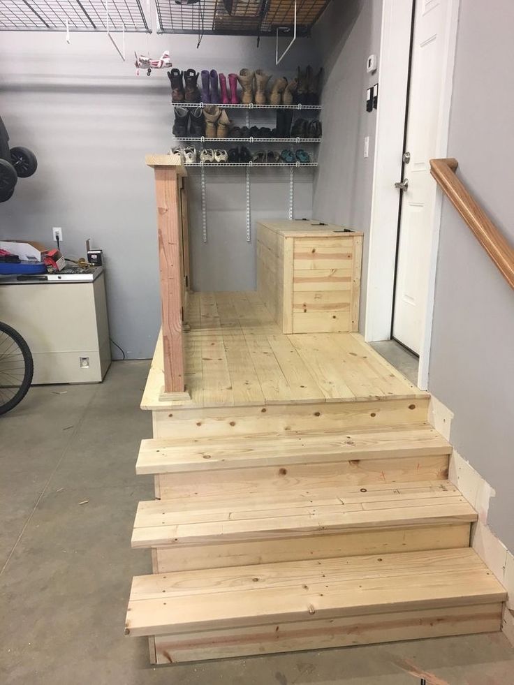 some stairs made out of wood in a garage