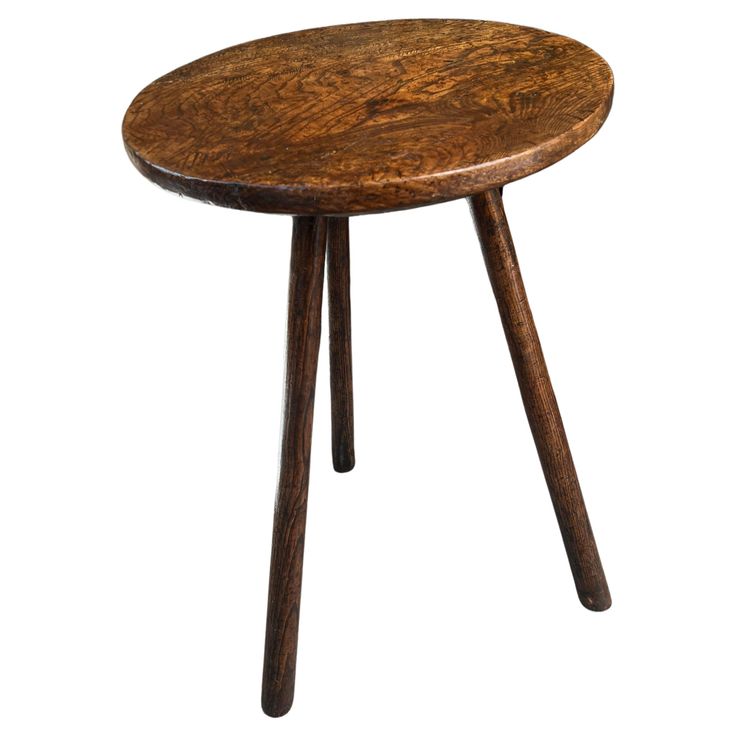 a wooden table with two legs and a small round top on the bottom, against a white background