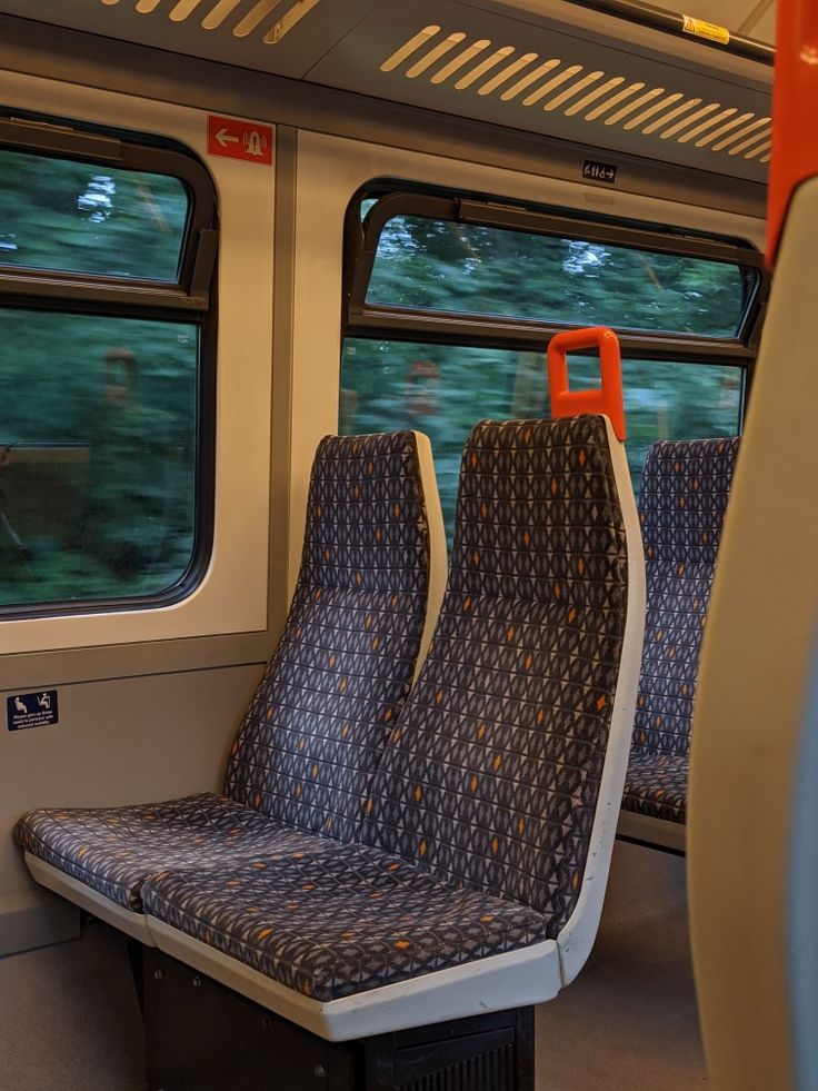 the seats are empty on the subway train