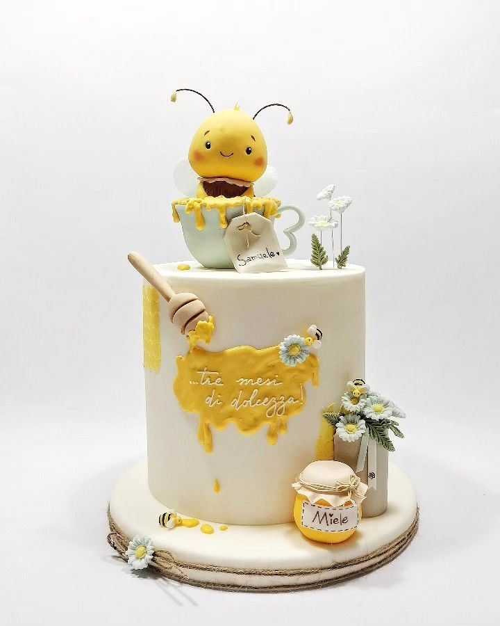 there is a cake decorated with bees and honey