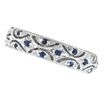 a white gold ring with blue sapphires