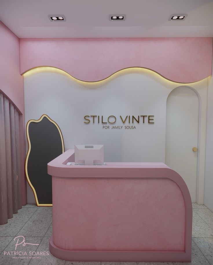 a pink counter in front of a white wall