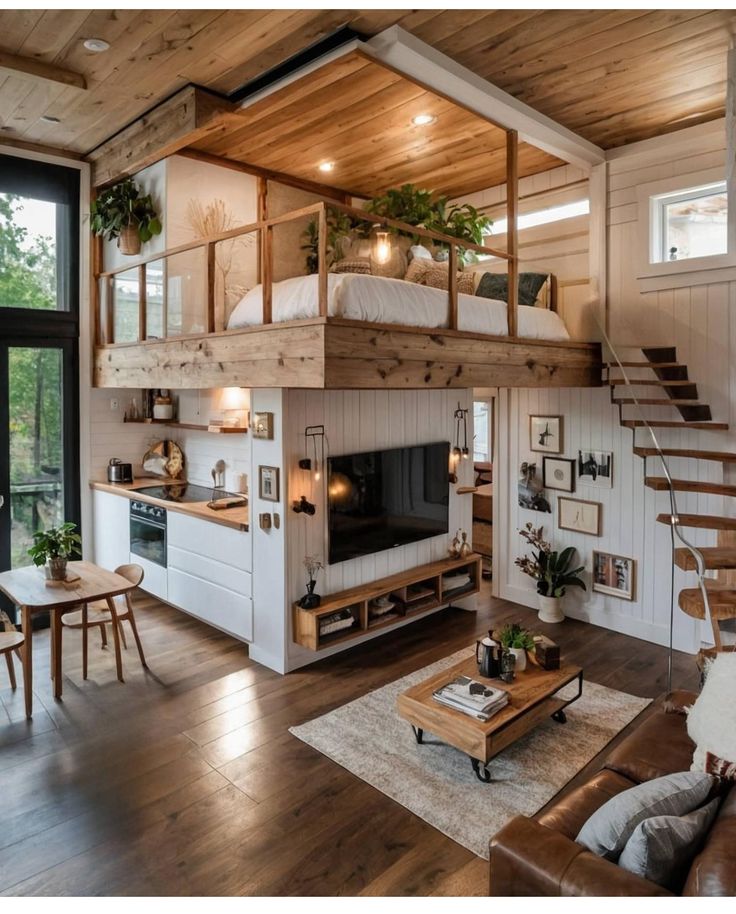 a living room filled with furniture and a fire place under a loft bed next to a window