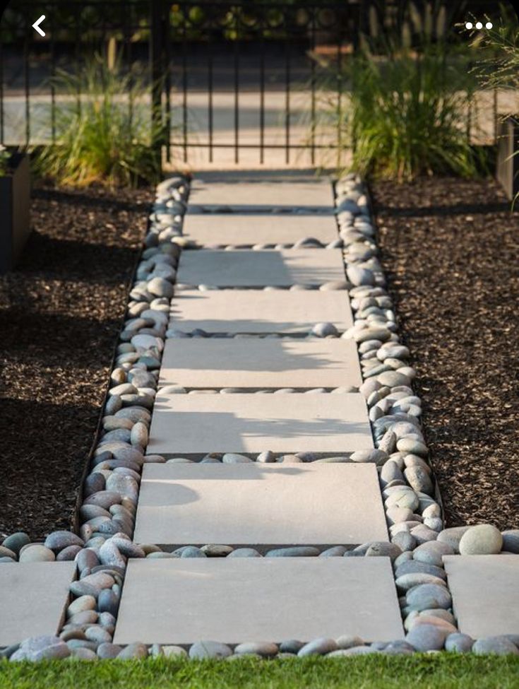 a walkway made out of rocks and gravel