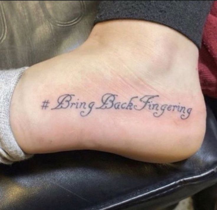 a person with a tattoo on their foot that says, bring back forgotteny and the word