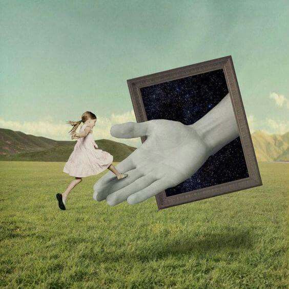 a giant hand reaching out to a woman's face in the middle of a field