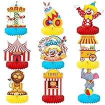 an assortment of circus themed cupcake toppers on display in front of a white background