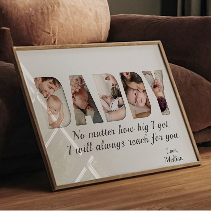 a family photo frame with the word dad written in multiple letters on it next to a couch