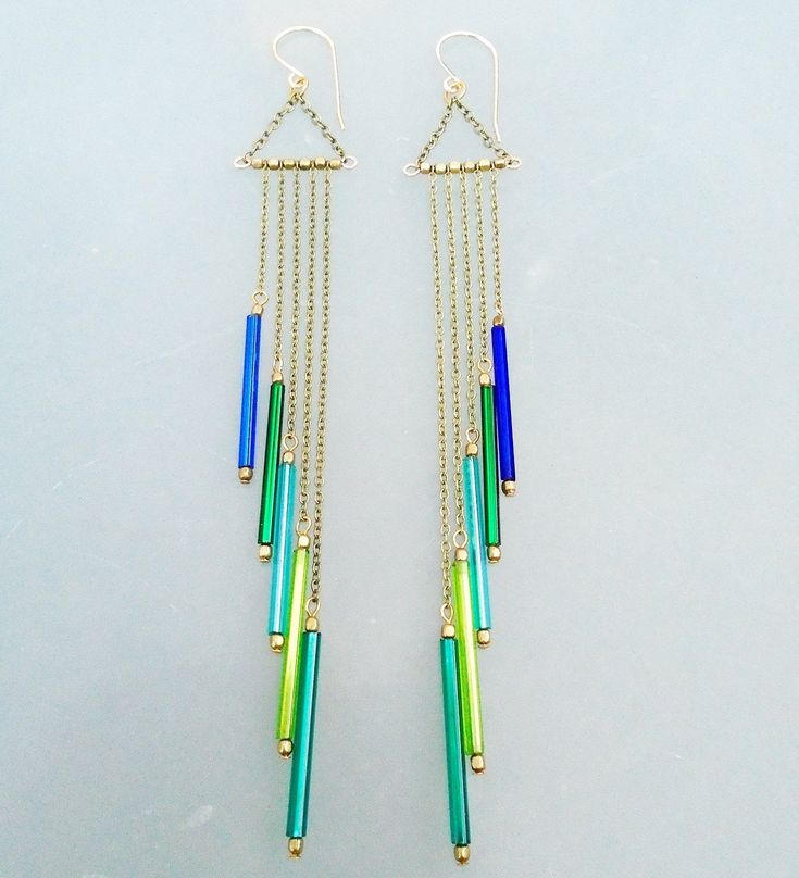 These earrings are inspired by the beautiful vintage bugle beads. The colors are amazing from the shades of blue and green. Brass chain, little African beads between the strands of chain. The ear wires are handmade, 14K gold filled, 20Ga, lever backs. The longest dangle is 110mm, the shortest is 60mm. I have more colors of these beads and the length can be adjusted if you like. ~Thank you for stopping by and supporting handmade, have a lovely day~ ~KR :) Tube Bead Jewelry, Tube Bead Earrings, Bugle Beads Earrings, Bugle Bead Jewelry, Bugle Bead Earrings, Beads Magic, Diy Earrings Easy, Beach Jewelry Boho, Beaded Chandelier Earrings