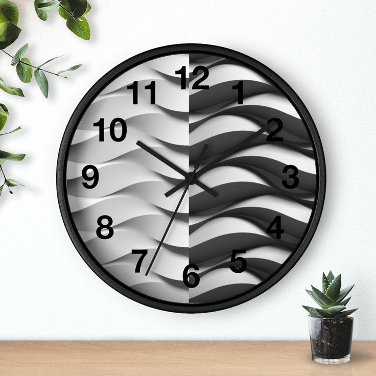 a clock that is on the wall next to a potted plant