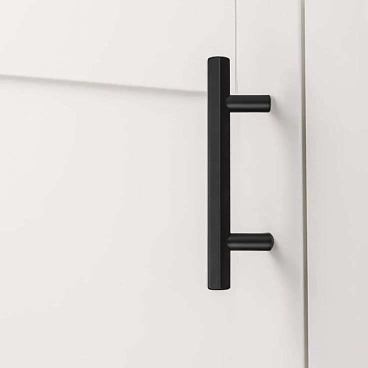 an open door with two black handles on it