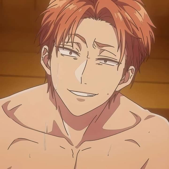 a man with red hair and no shirt on looking at the camera while staring straight ahead