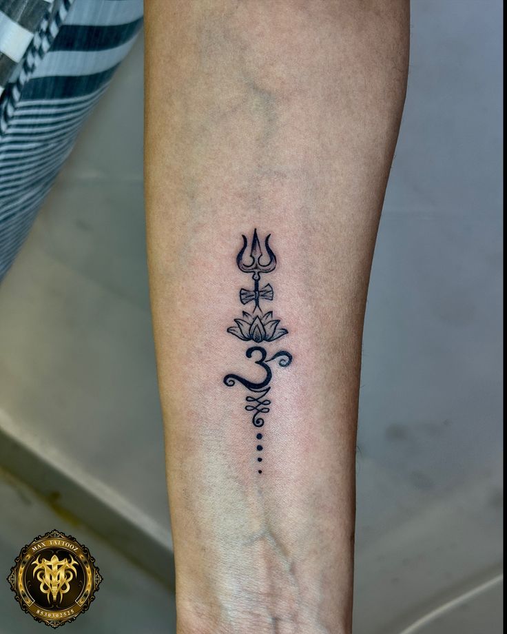 a woman's foot with a tattoo design on the left side of her leg