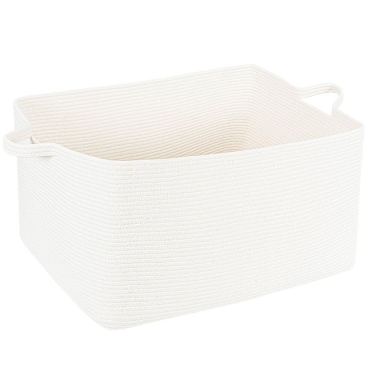 a white storage basket with handles