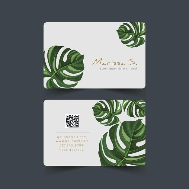 two business cards with tropical leaves on them