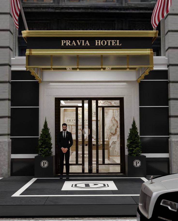 a man standing in front of a hotel entrance with an american flag on the door