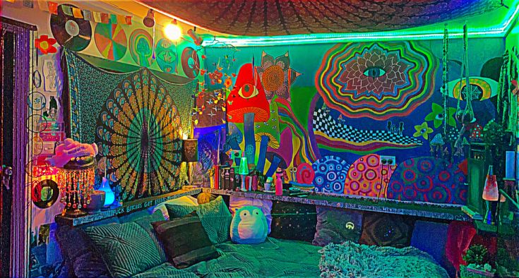 a bed room with lots of colorful lights and decorations on the walls, along with many other items