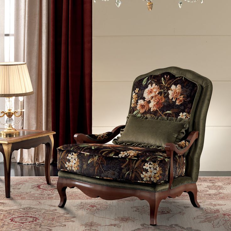 a living room with a chair, table and chandelier