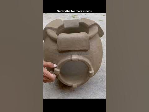 someone is making a vase out of clay