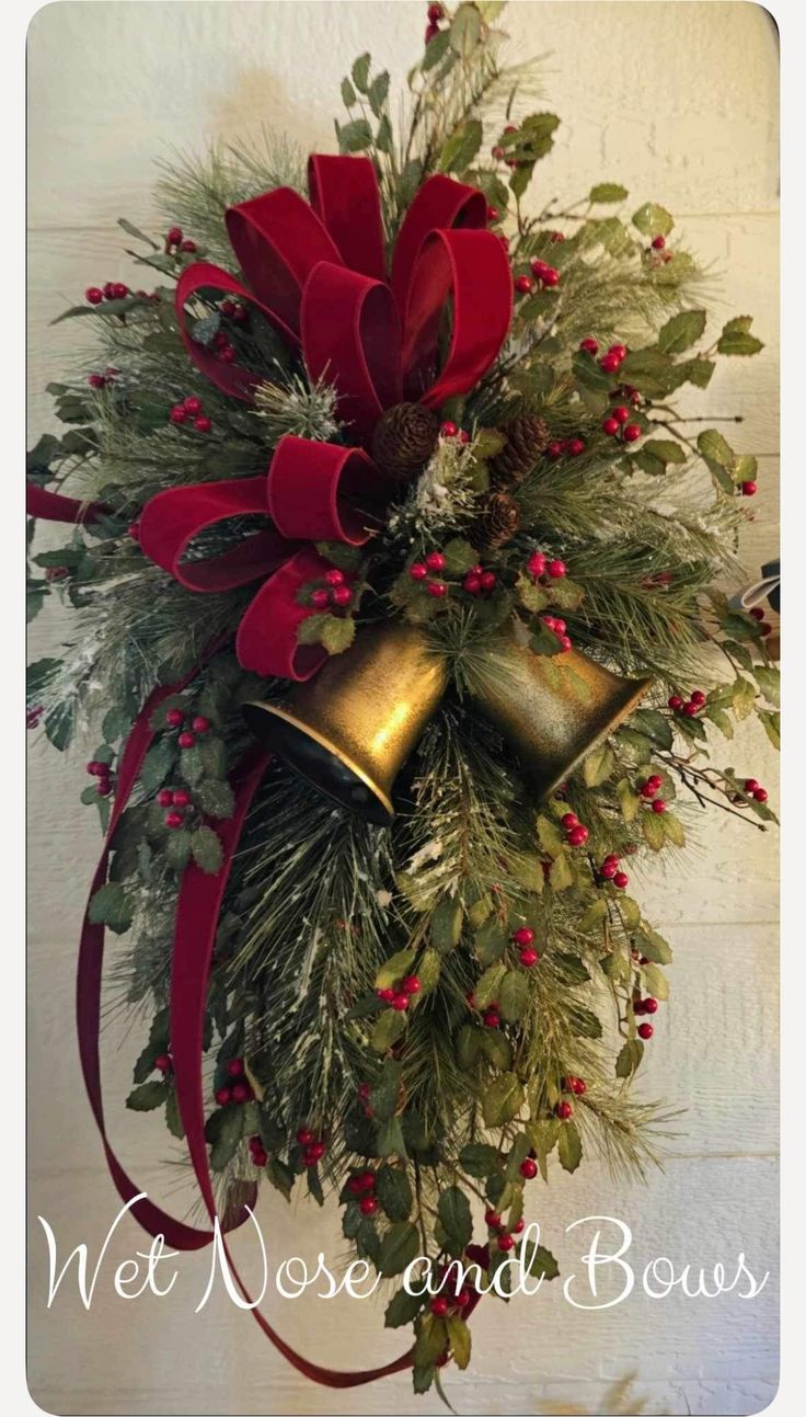 a christmas wreath with bells and greenery