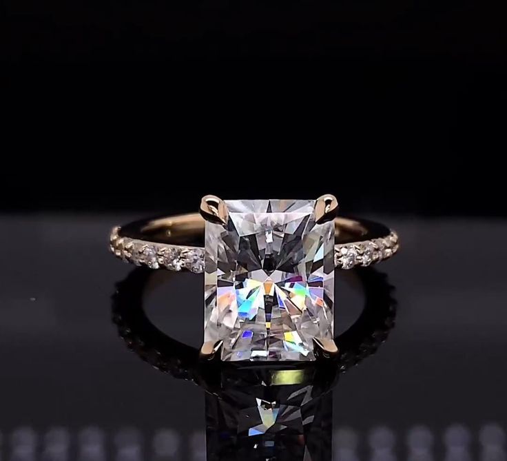 an engagement ring with a princess cut diamond