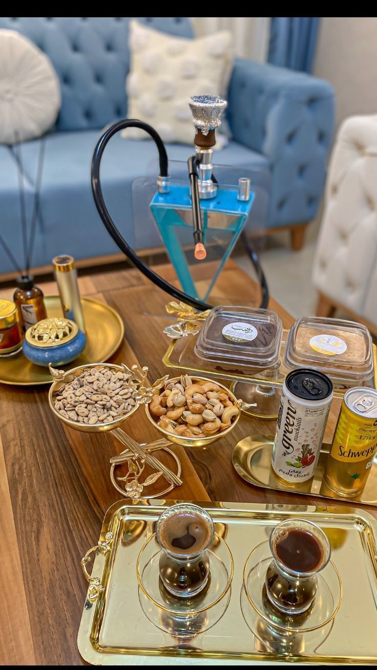 the table is full of different types of condiments and snacks on it's tray