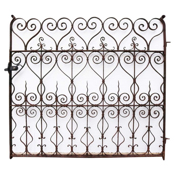 an old iron fence with scroll designs on the top and bottom, isolated against a white background