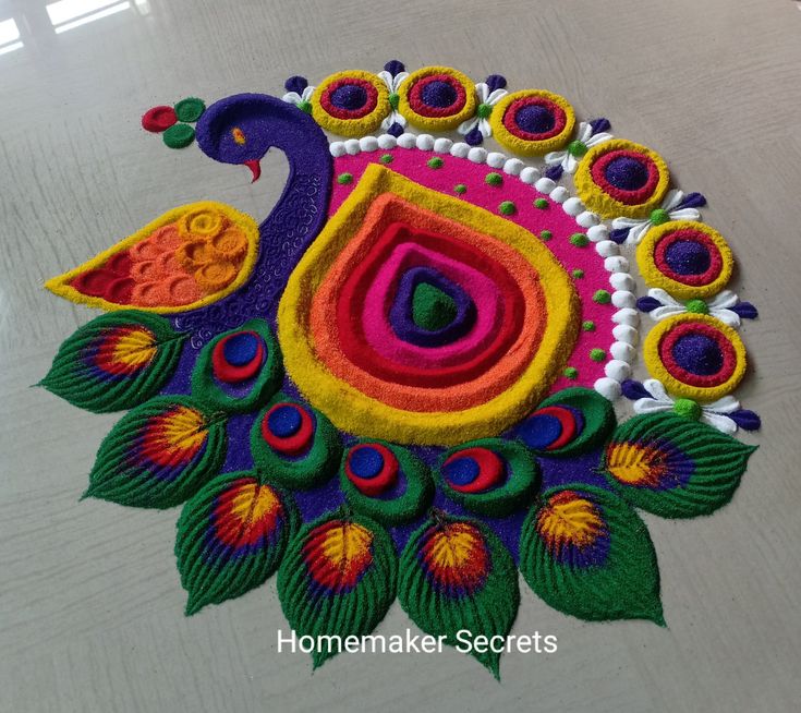 a colorful peacock design is on the floor