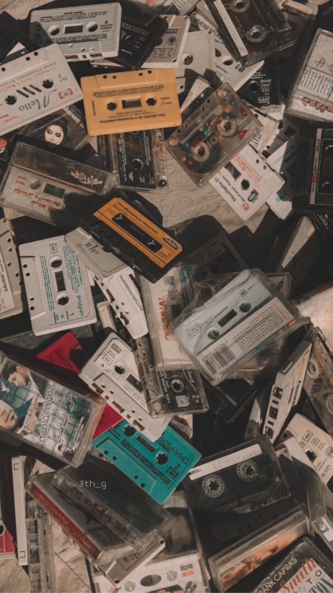 an image of old cassettes piled on top of each other in the middle of the floor