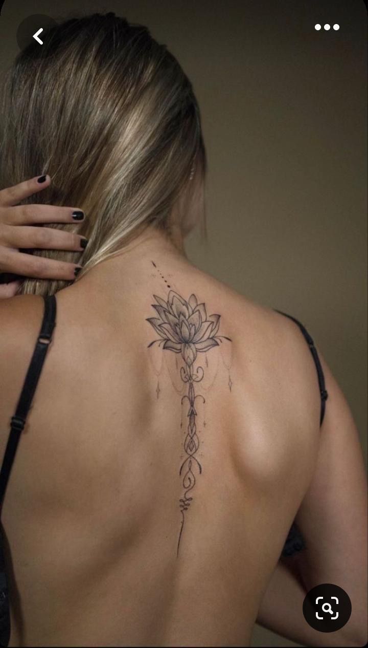 a woman with a tattoo on her back