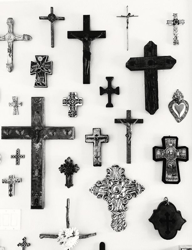 an assortment of crosses are displayed on a white background with black and white images around them