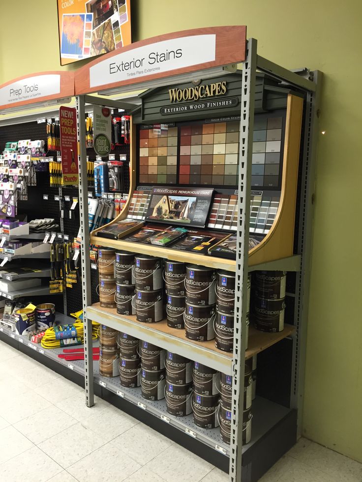 a store with shelves filled with different types of paint