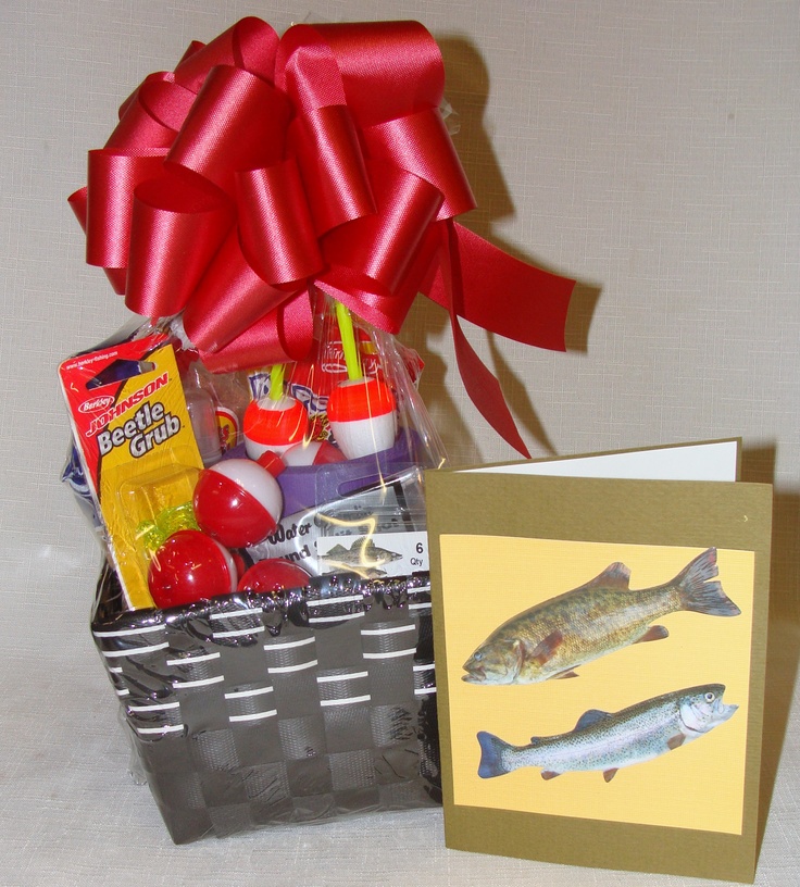 a gift basket filled with food next to a card