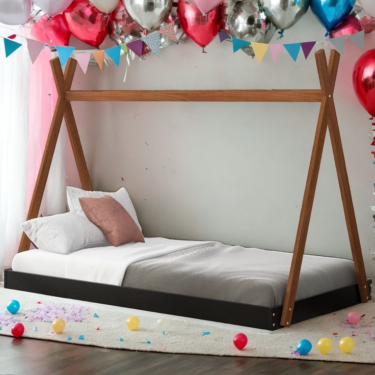 a bed that has some balloons on it