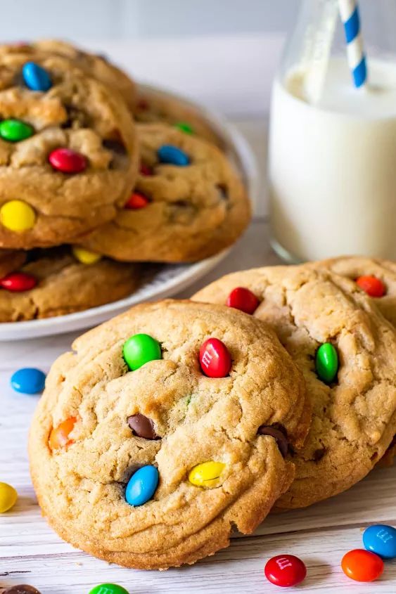 cookies with m & m and milk on the side