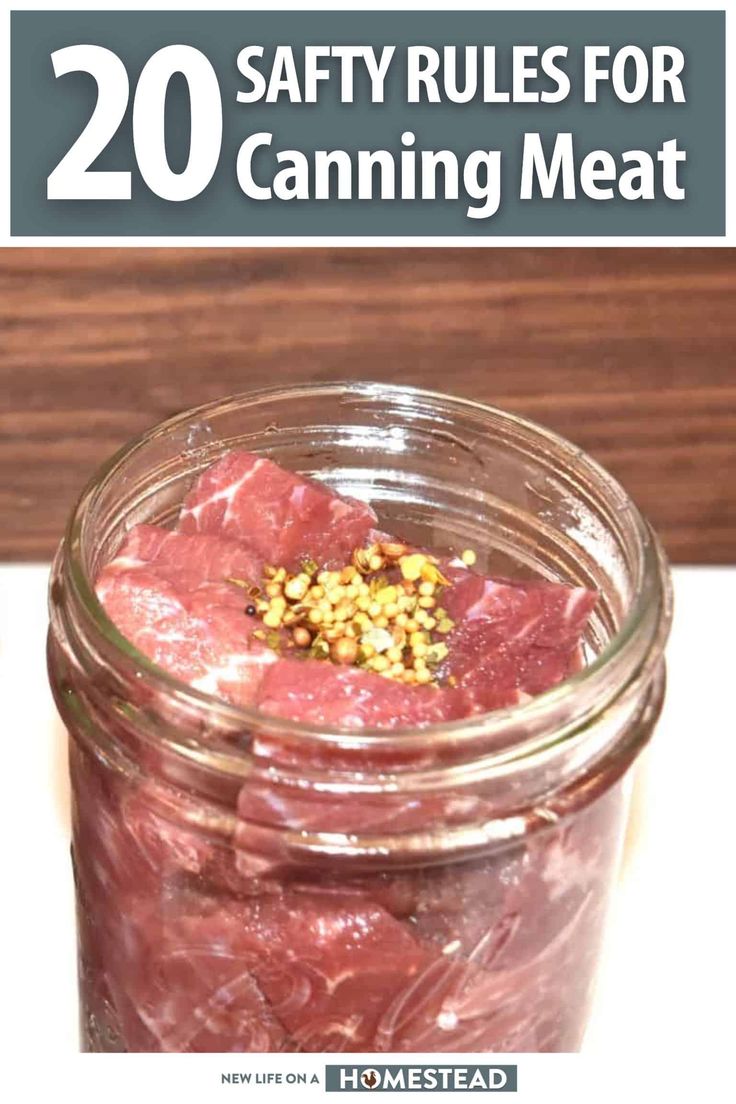 a mason jar filled with raw meat sitting on top of a table