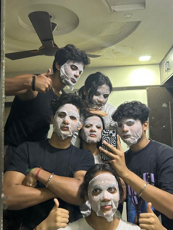 a group of people with their faces painted