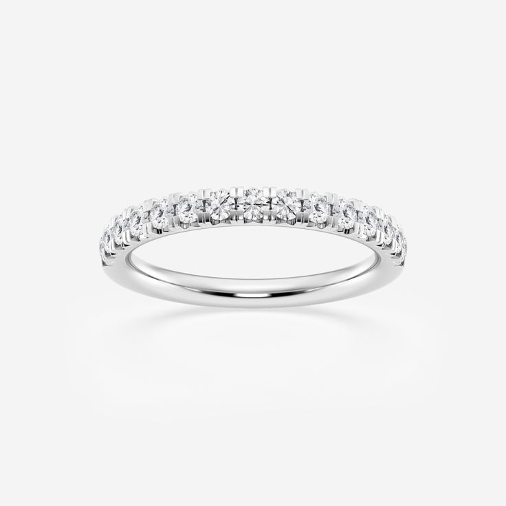 a white gold wedding ring with three rows of diamonds on the top and bottom half