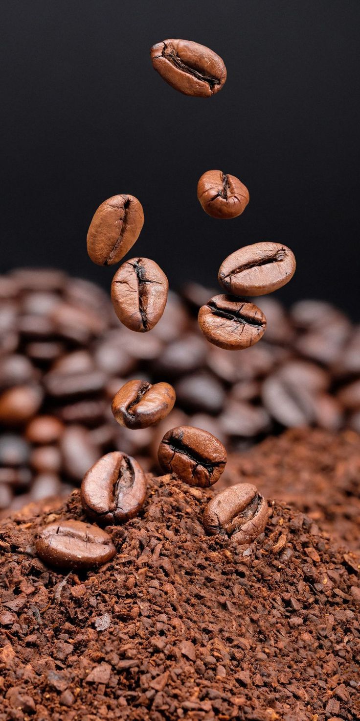 coffee beans fall into the ground and are being tossed over by falling down on them