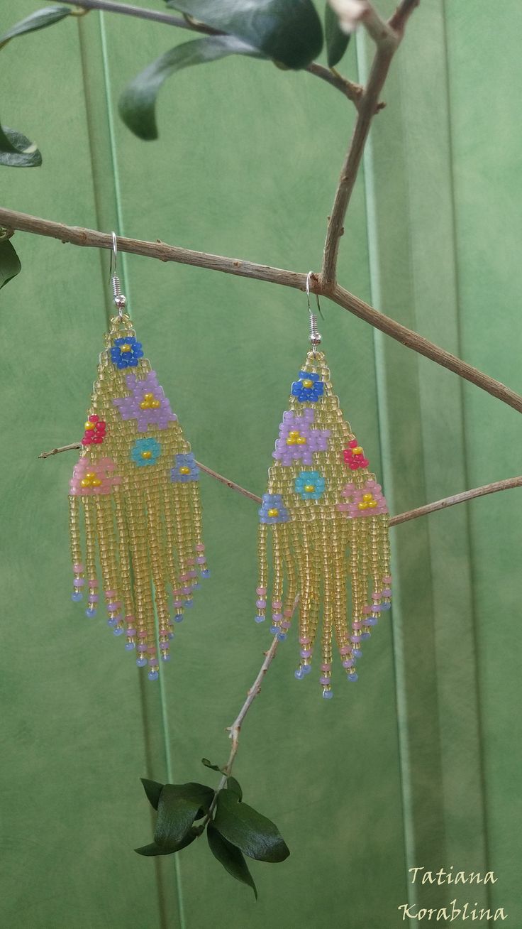 These handmade unique earrings with abstract floral print are made of high-quality Czech beads and strong synthetic thread. I use my author's scheme . They are elegant, fashionable, and highly versatile, suitable for everyday wear. Color:beige, gold, yellow,pink,red,blue,purple, lilac. I beg you not to copy my authoring 100% hand made with love! Measurements: Length-9 cm (with schwenze) , Width -3 cm Materials: Silver plated ear hooks Czech glass beads Nylon Thread Whimsical Gold Earrings For Festival, Yellow Beaded Earrings With Ear Wire For Summer, Summer Yellow Beaded Earrings With Ear Wire, Yellow Dangling Beads Earrings For Summer, Bohemian Yellow Beaded Dangle Earrings, Summer Yellow Dangling Beads Earrings, Bohemian Jewelry With Dangling Beads For Spring, Yellow Bohemian Earrings For Summer, Yellow Summer Earrings With Dangling Beads