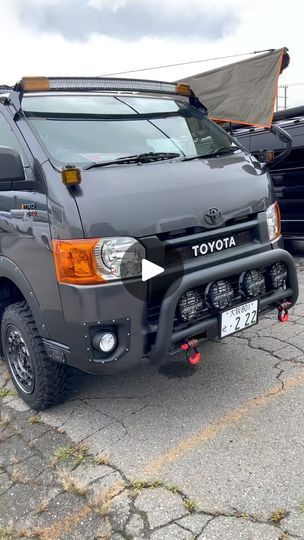 a gray toyota truck parked in a parking lot