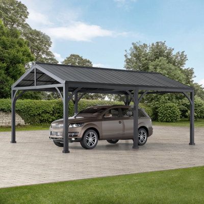 a car is parked under a metal carport