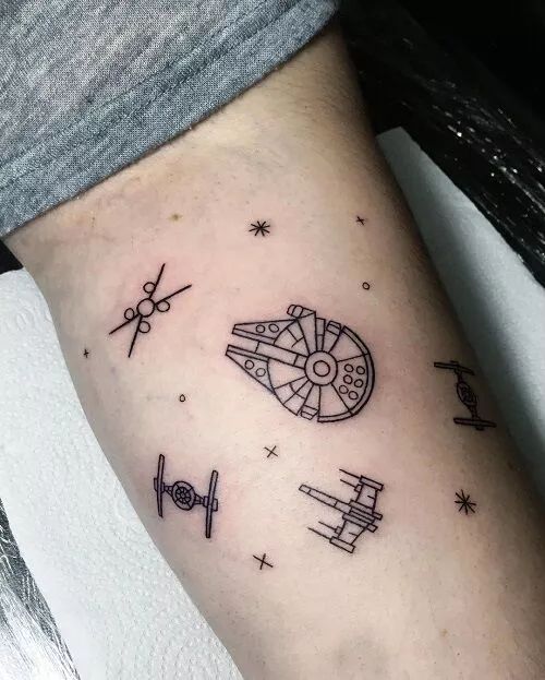 a star wars themed tattoo on the arm