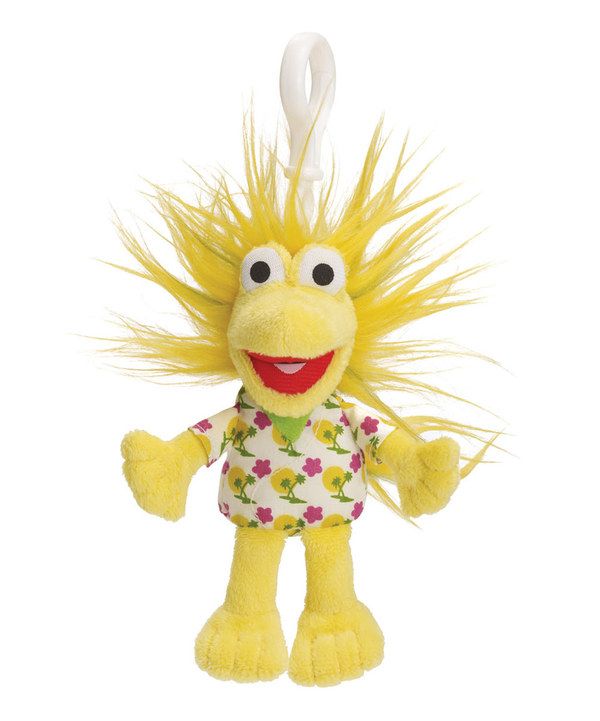 a yellow stuffed animal with long hair on it's head and eyes, wearing a flower shirt