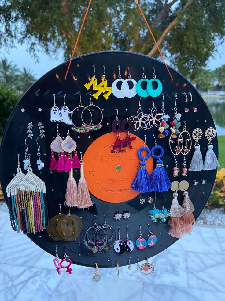 a circular display with earrings hanging from it