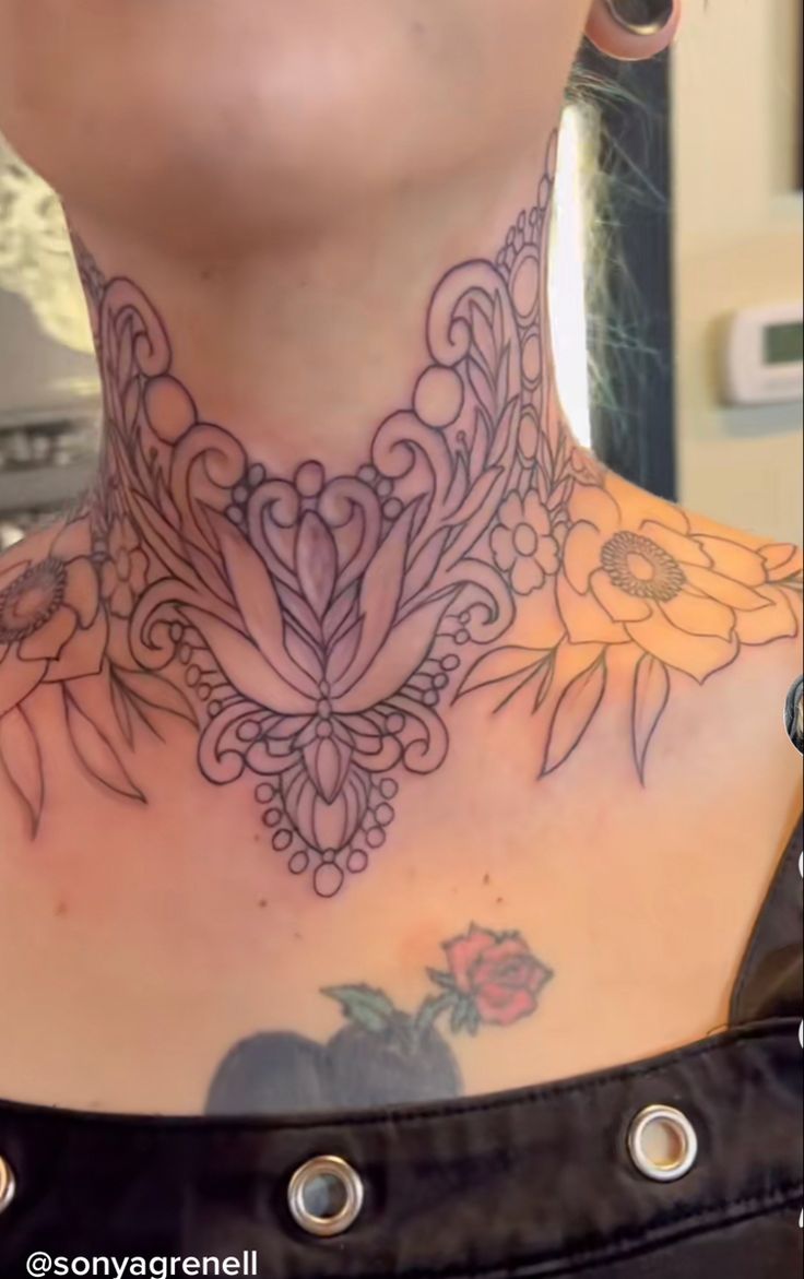 a woman with a tattoo on her neck