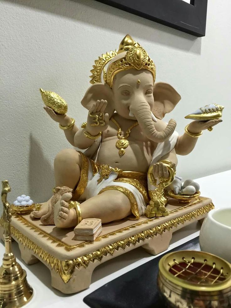 an elephant statue sitting on top of a table