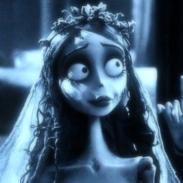 the corpse bride is holding her hand up