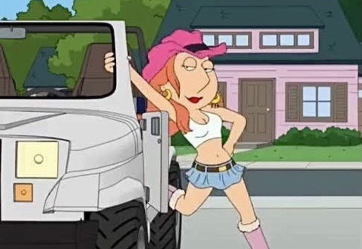 a woman standing in front of a car with her hands on her hips while wearing a pink hat