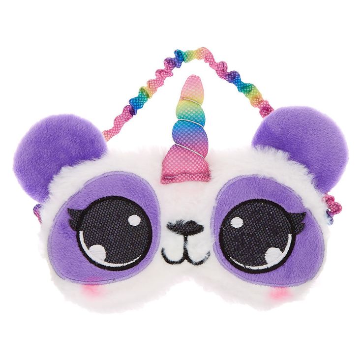 a purple and white panda bear mask with a unicorn horn on it's head